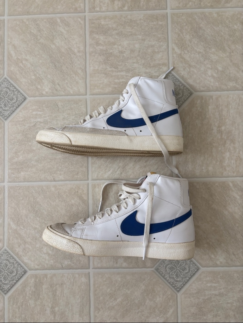 Nike White High-Top Sneakers with Blue Swoosh